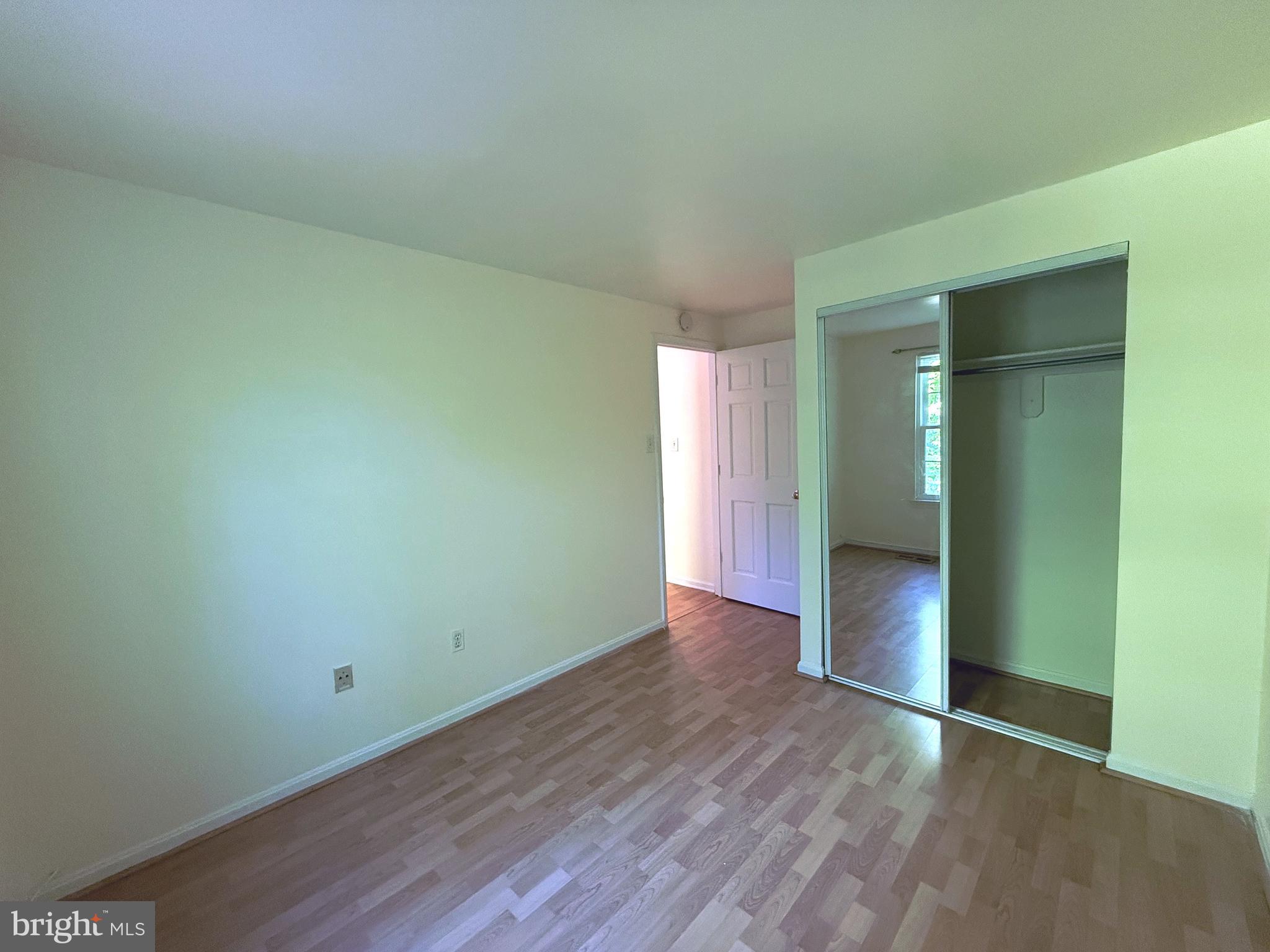11 Wimbledon Court Silver Spring, MD 20906 - Photo 14 of 21 an empty room with wooden floor & closet area