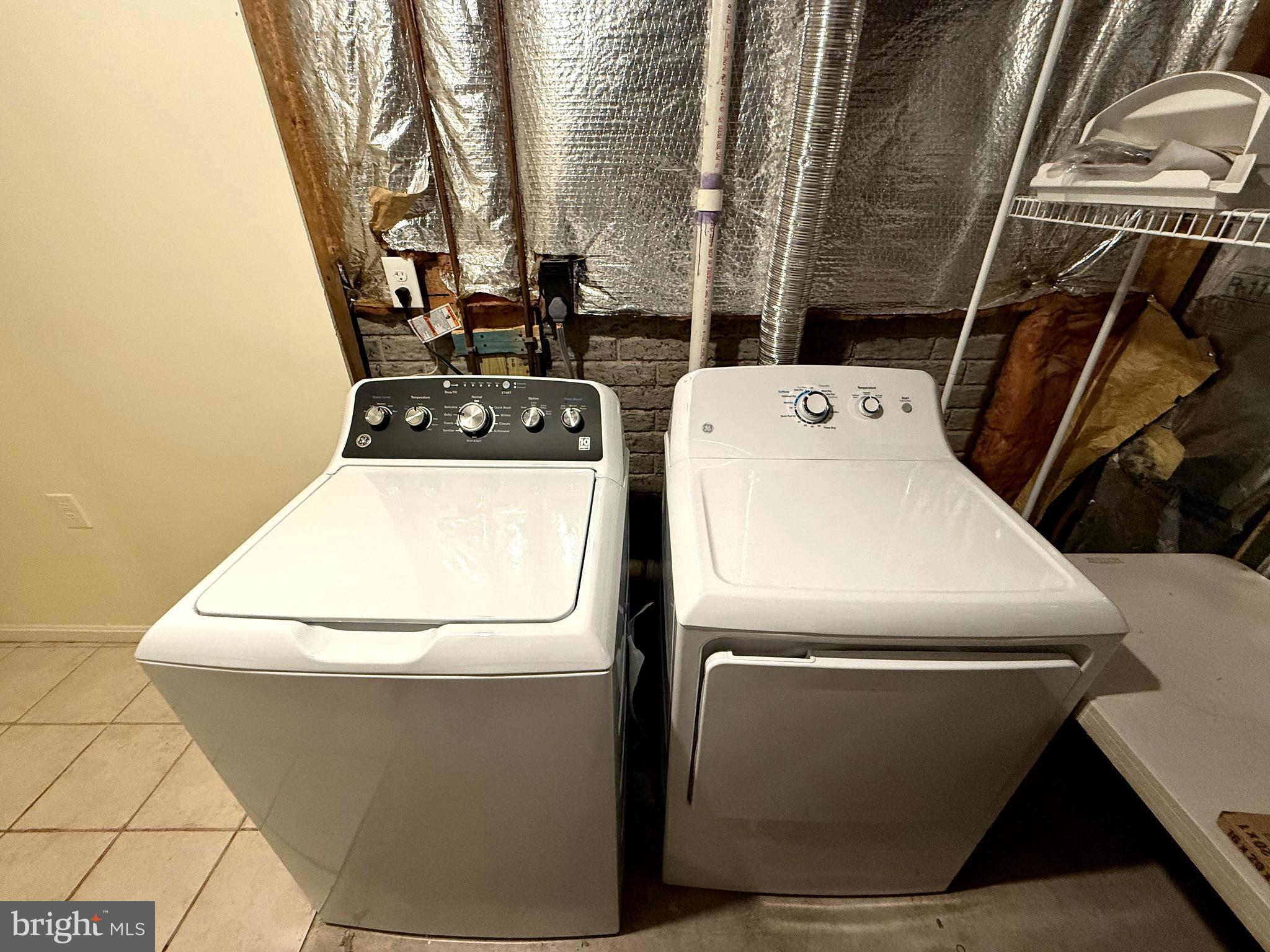 11 Wimbledon Court Silver Spring, MD 20906 - Photo 17 of 21 a utility room with dryer and washer