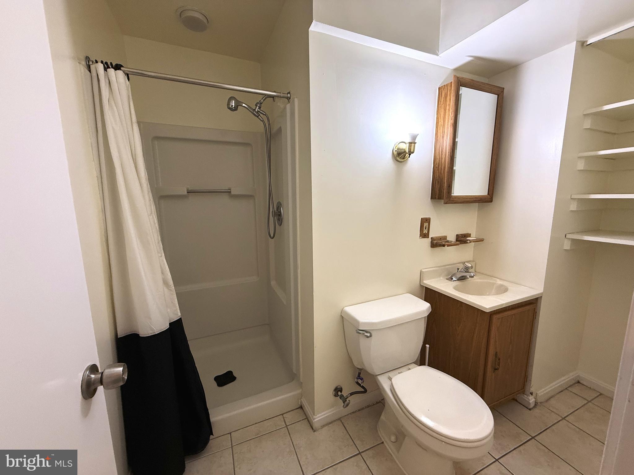 11 Wimbledon Court Silver Spring, MD 20906 - Photo 19 of 21 a bathroom with a toilet a sink and a shower