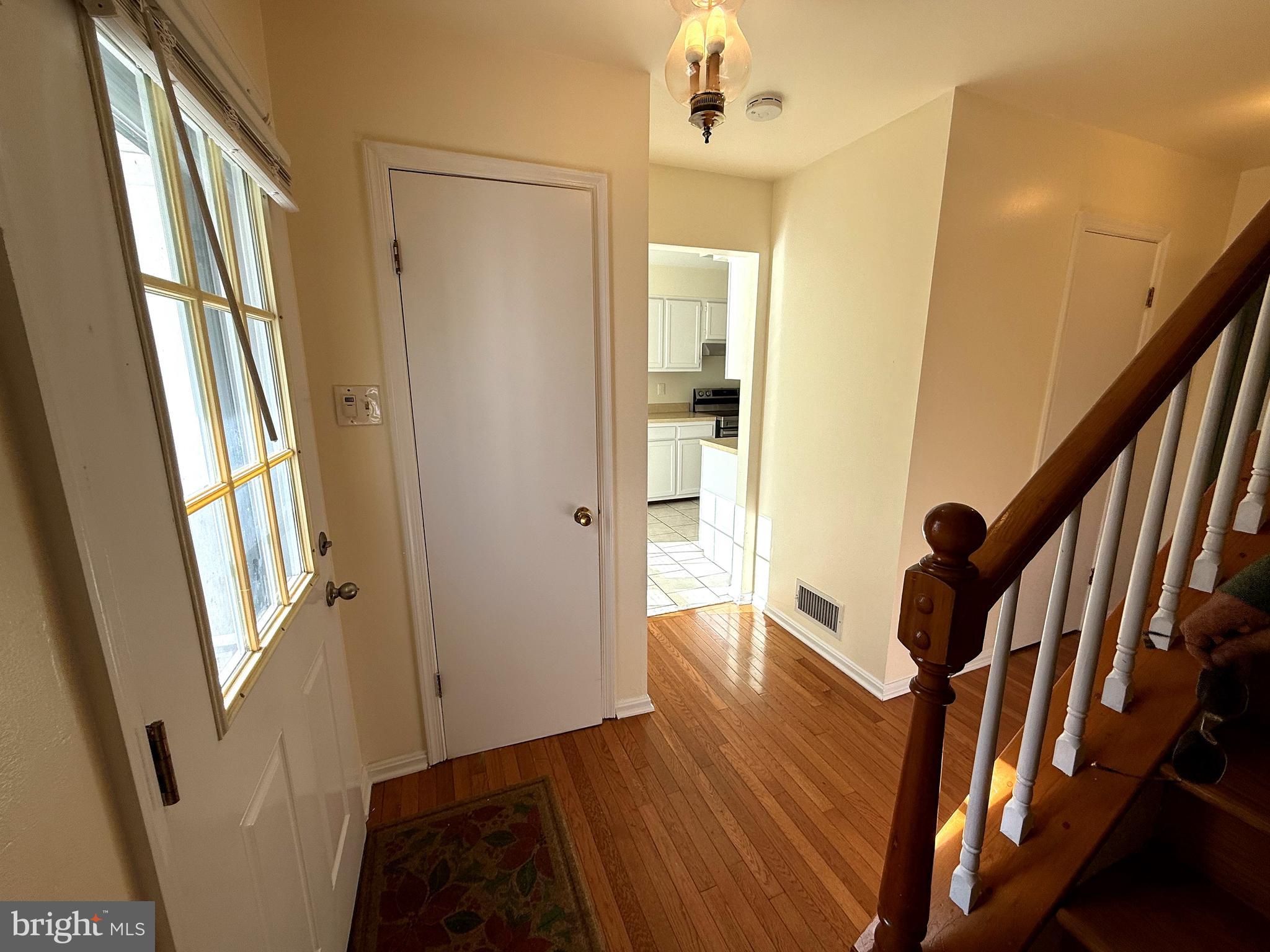 11 Wimbledon Court Silver Spring, MD 20906 - Photo 3 of 21 a view of an entryway with wooden floor and stairs
