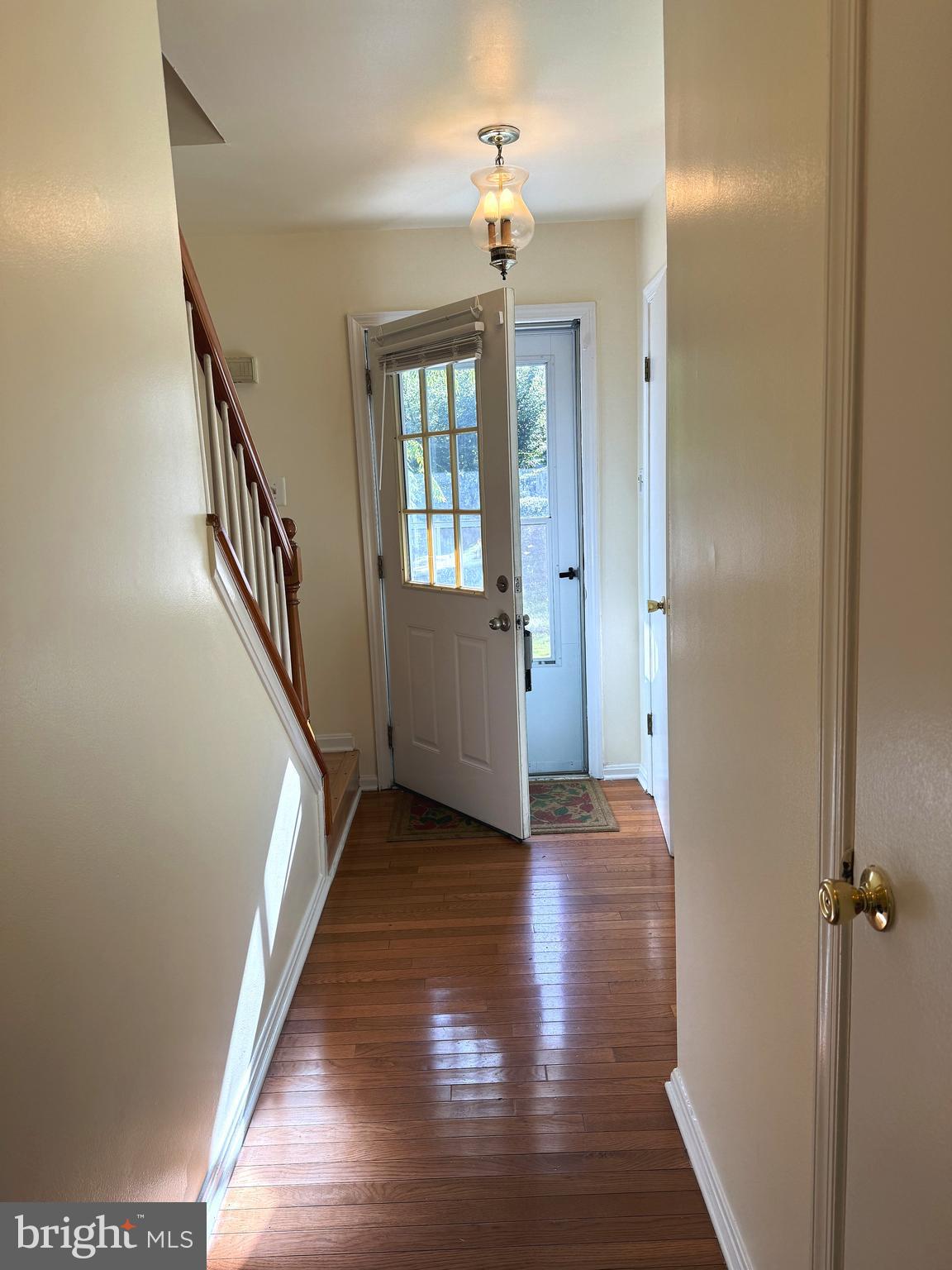 11 Wimbledon Court Silver Spring, MD 20906 - Photo 9 of 21 a view of a hallway with wooden floor and staircase
