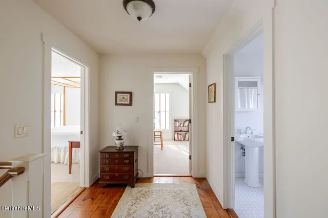 a bedroom with furniture and a wooden floor