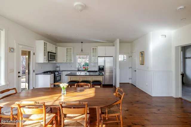 a kitchen with a table and chairs in it