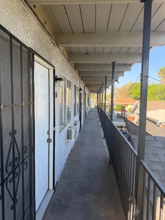 a view of a porch with wooden floor and stairs