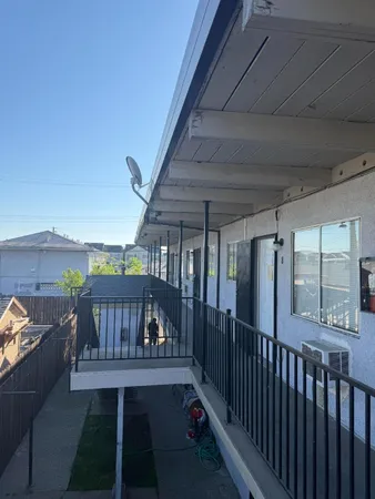 a view of balcony with furniture