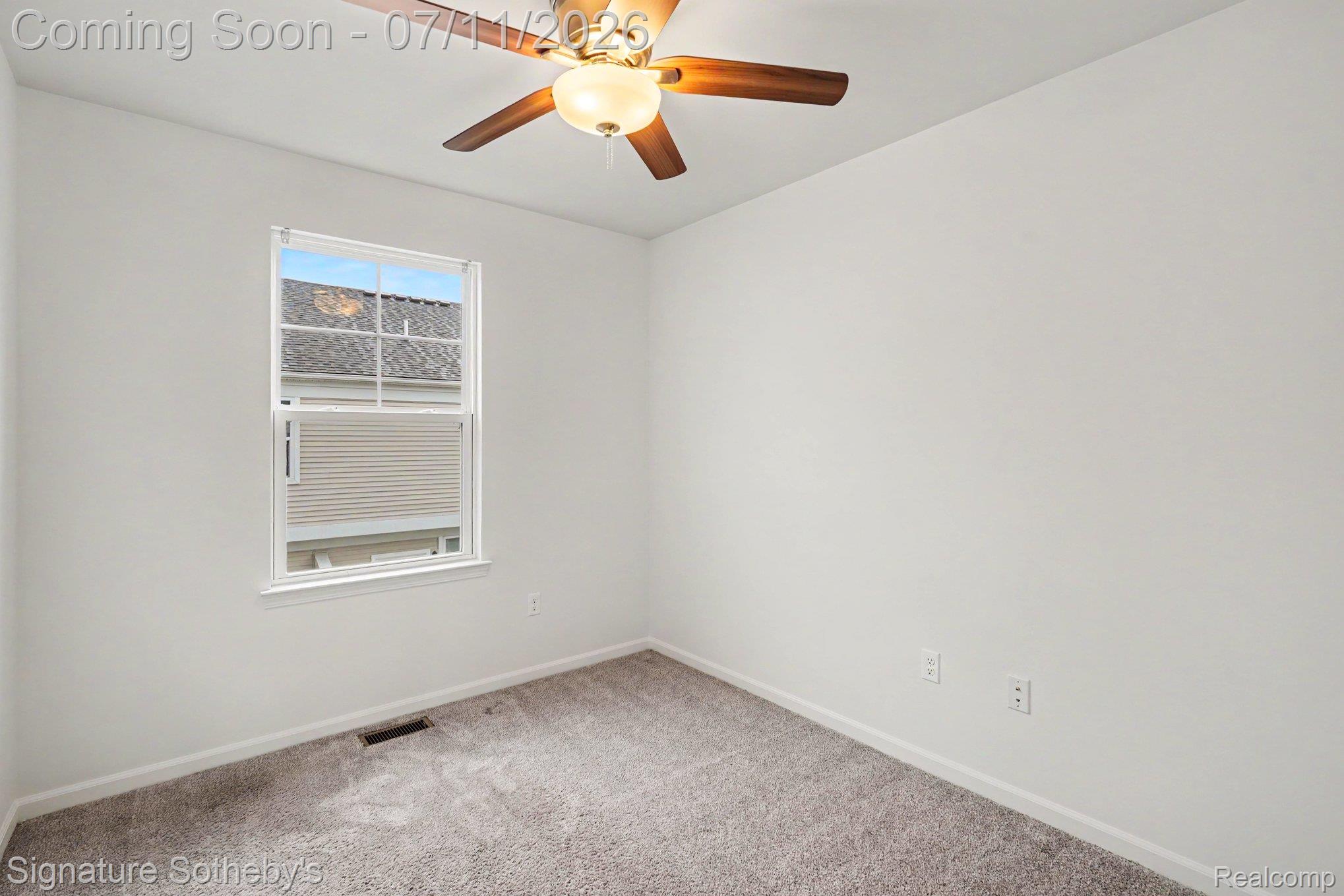 2500 Normandy Road, Unit 40 Royal Oak, MI 48073 - Photo 17 of 26 Neutral-toned wall-to-wall carpeting complements the white walls