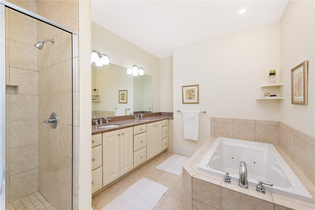 8 Kettle Cl Westerly, RI 02891 - Photo 20 of 39 The main bath features a separate shower, a tub and double sinks.
