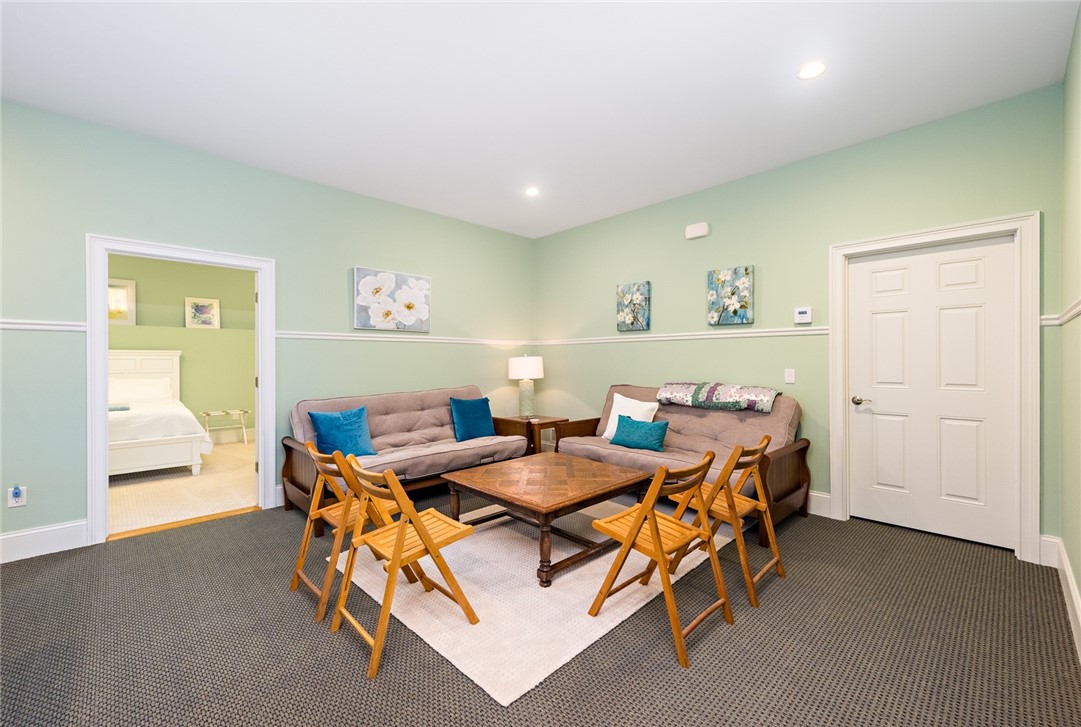 8 Kettle Cl Westerly, RI 02891 - Photo 28 of 39 A lower level sitting area is great for overflow guests.