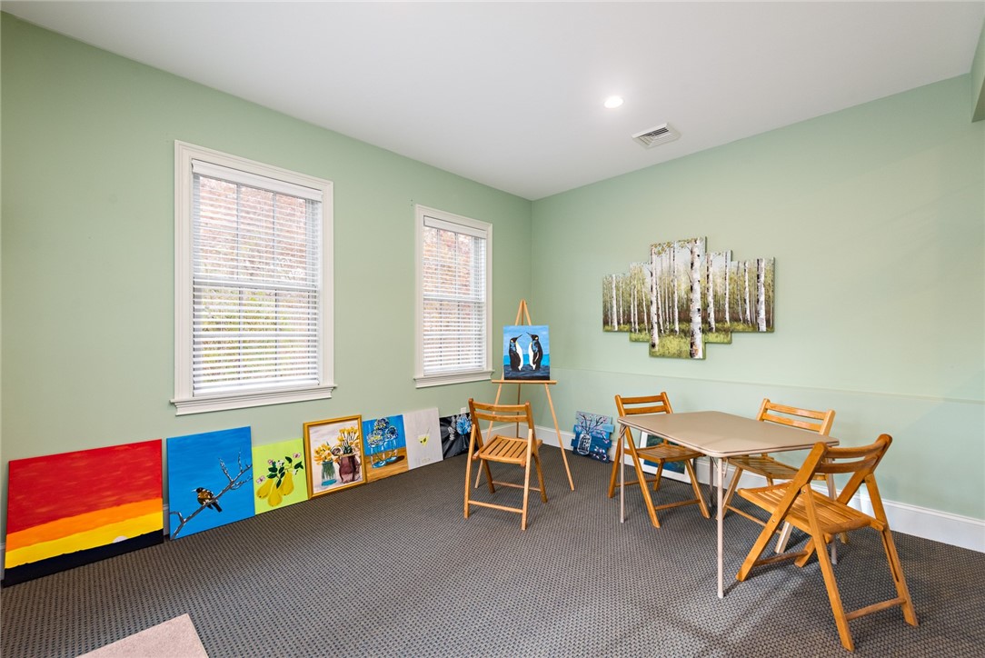 8 Kettle Cl Westerly, RI 02891 - Photo 29 of 39 A bonus space leads outside to a small terrace.