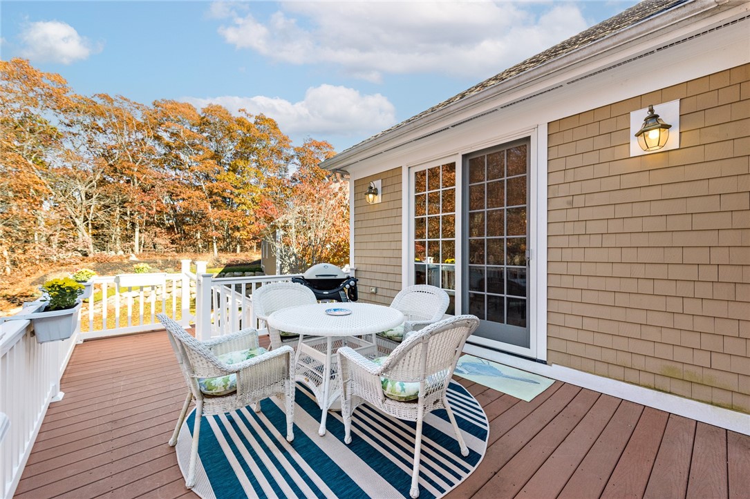 8 Kettle Cl Westerly, RI 02891 - Photo 36 of 39 The back deck provides a shaded area for enjoying evenings outdoors