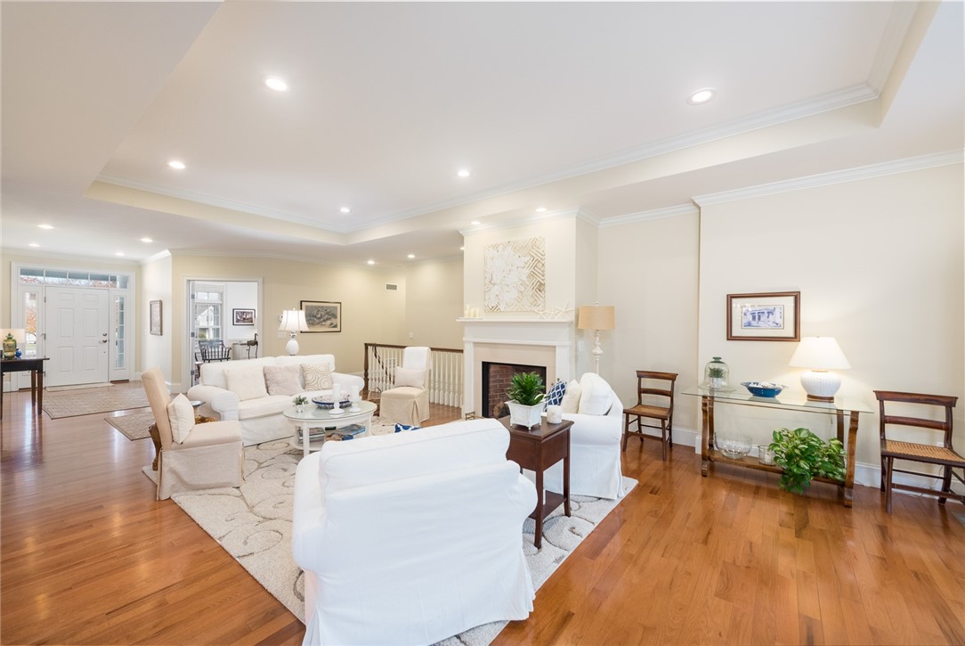 8 Kettle Cl Westerly, RI 02891 - Photo 4 of 39 A large and expansive living room features a tray ceiling and a beautiful gas fireplace!