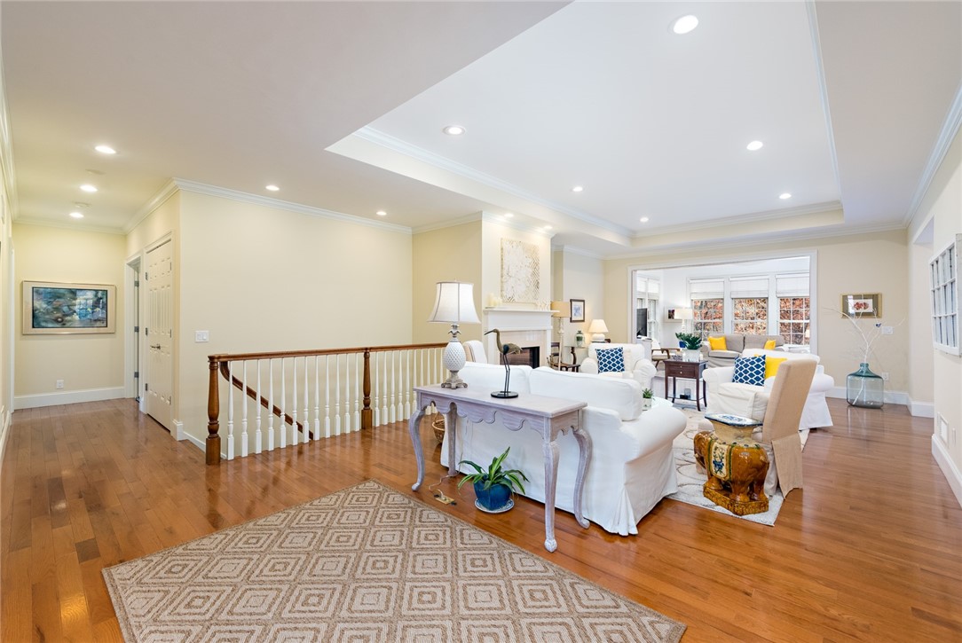 8 Kettle Cl Westerly, RI 02891 - Photo 5 of 39 Living Room features an inviting sun room beyond.