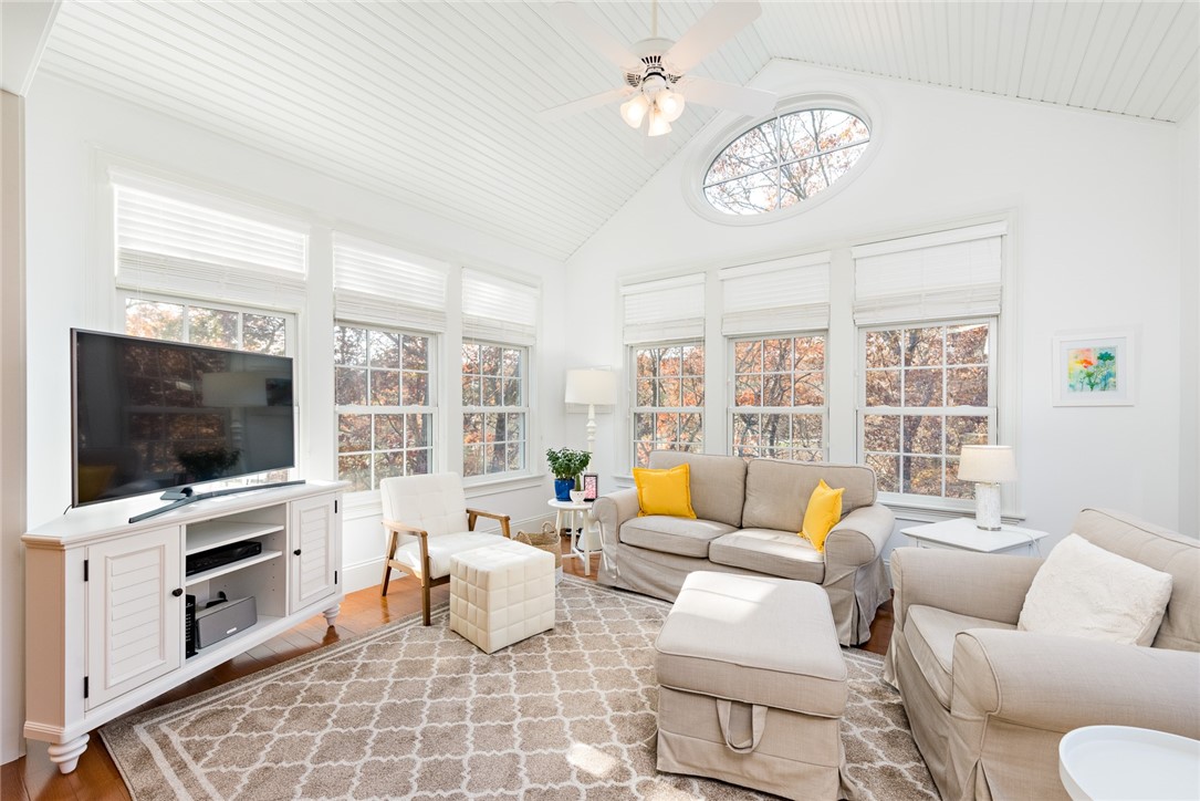 8 Kettle Cl Westerly, RI 02891 - Photo 9 of 39 This sunroom backs up to woods owned by a Land Trust and is very private.