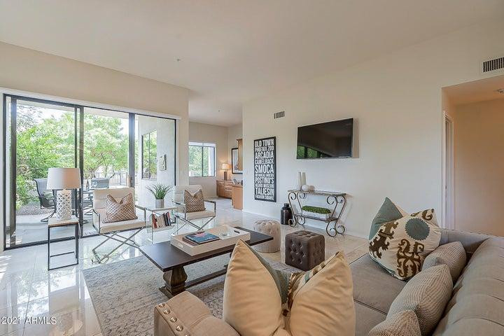 7700 East Gainey Ranch Road, Unit 153 Scottsdale, AZ 85258 - Photo 11 of 24 a living room with furniture and a flat screen tv