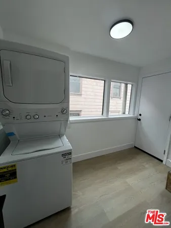 a view of storage and utility room with washer and dryer