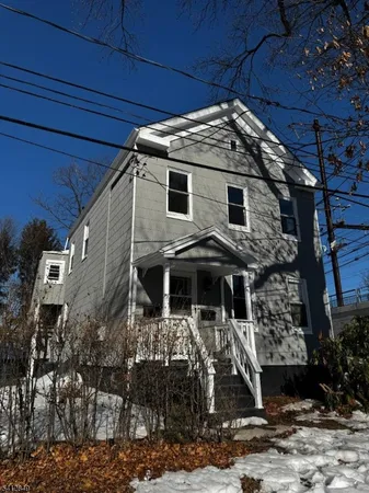 a front view of a house with parking