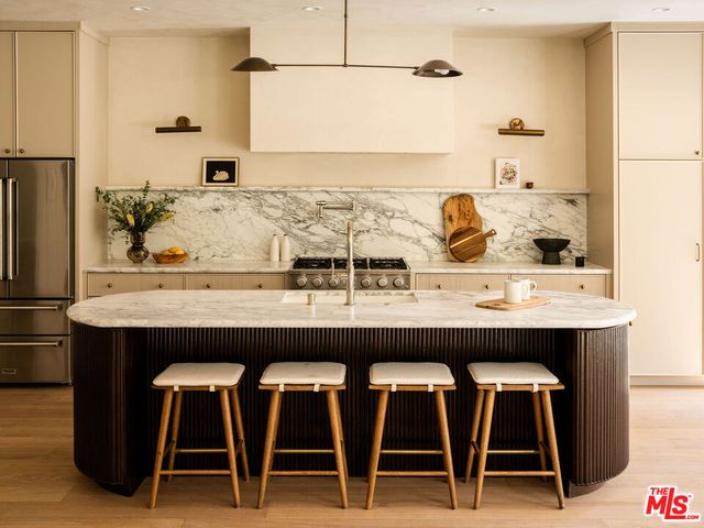 a kitchen with a table and chairs