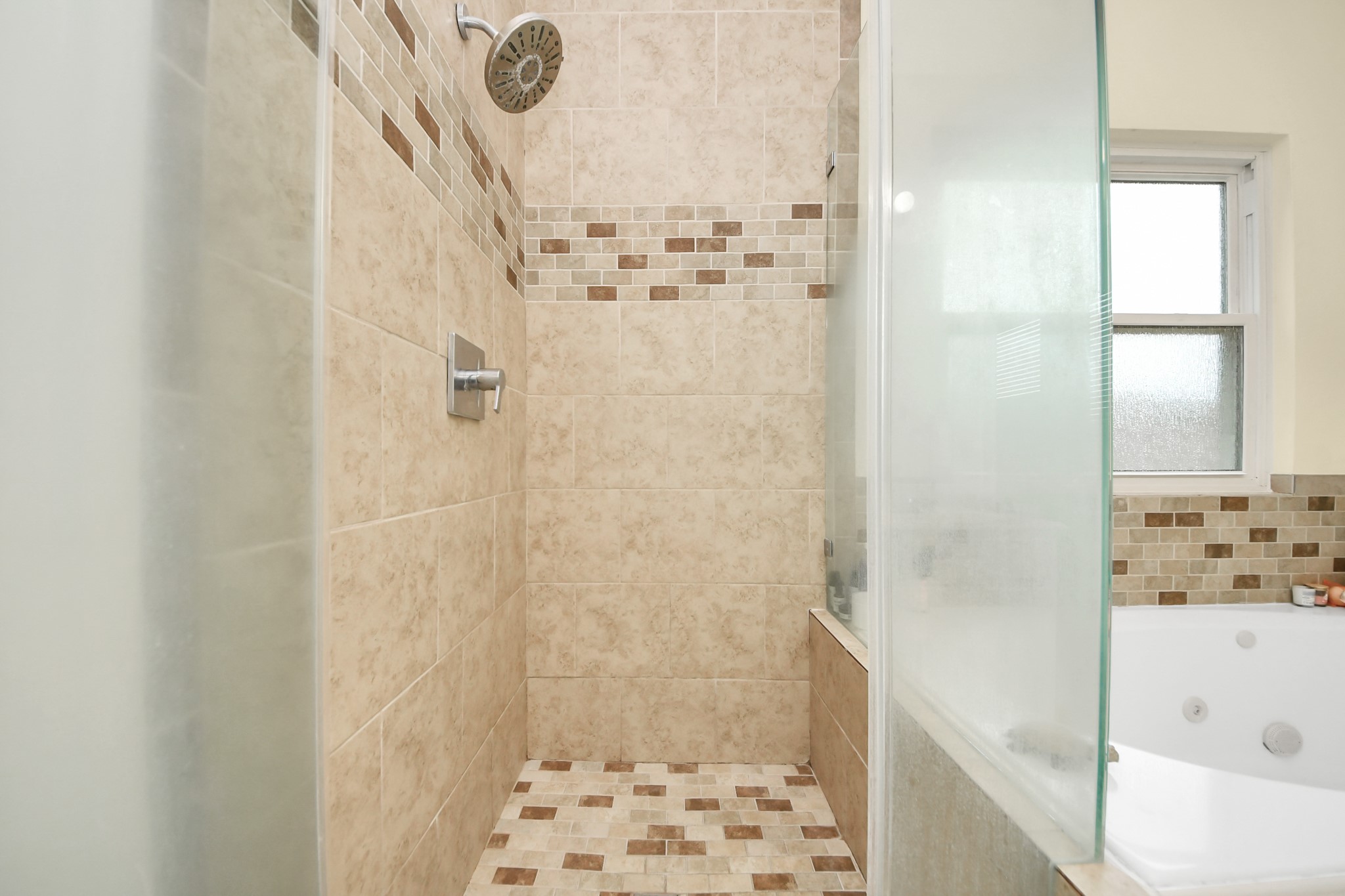 23814 Spring Dane Drive Spring, TX 77373 - Photo 28 of 41 a bathroom with a bathtub and shower