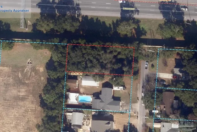 an aerial view of houses with outdoor space