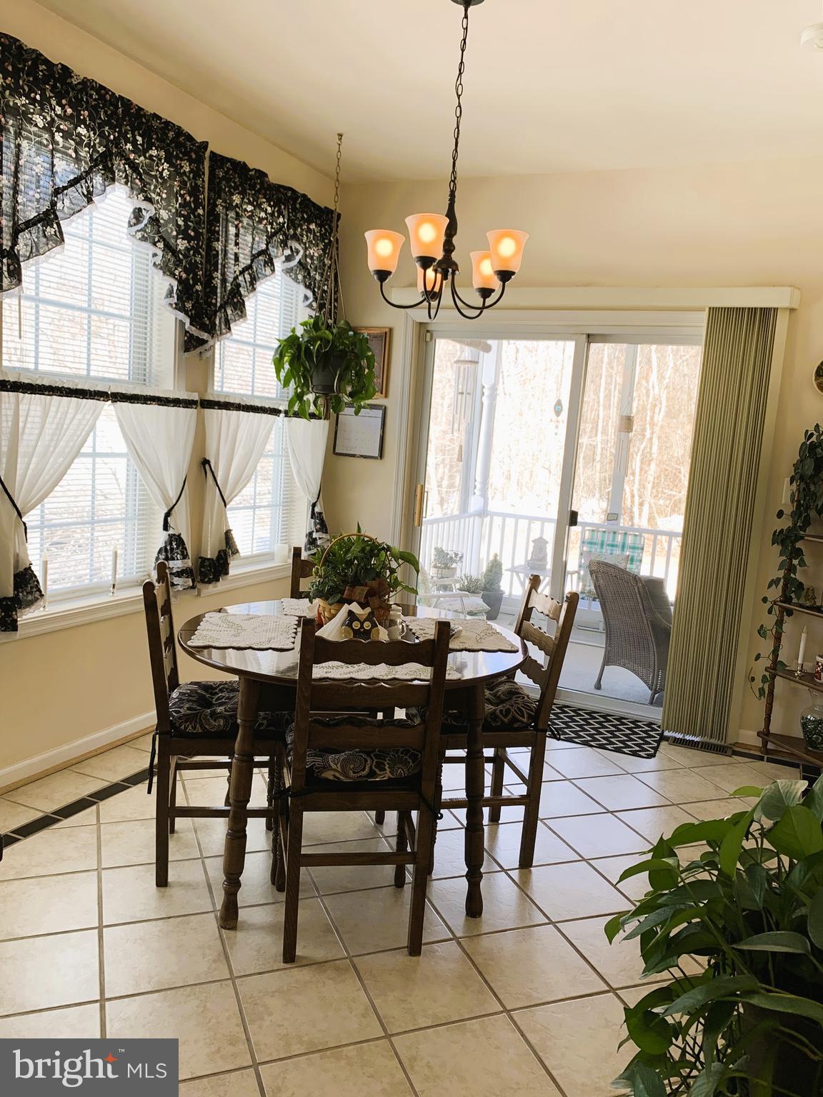 21112 Park Hall Road Boonsboro, MD 21713 - Photo 15 of 39 a view of a dining room with furniture window and outside view