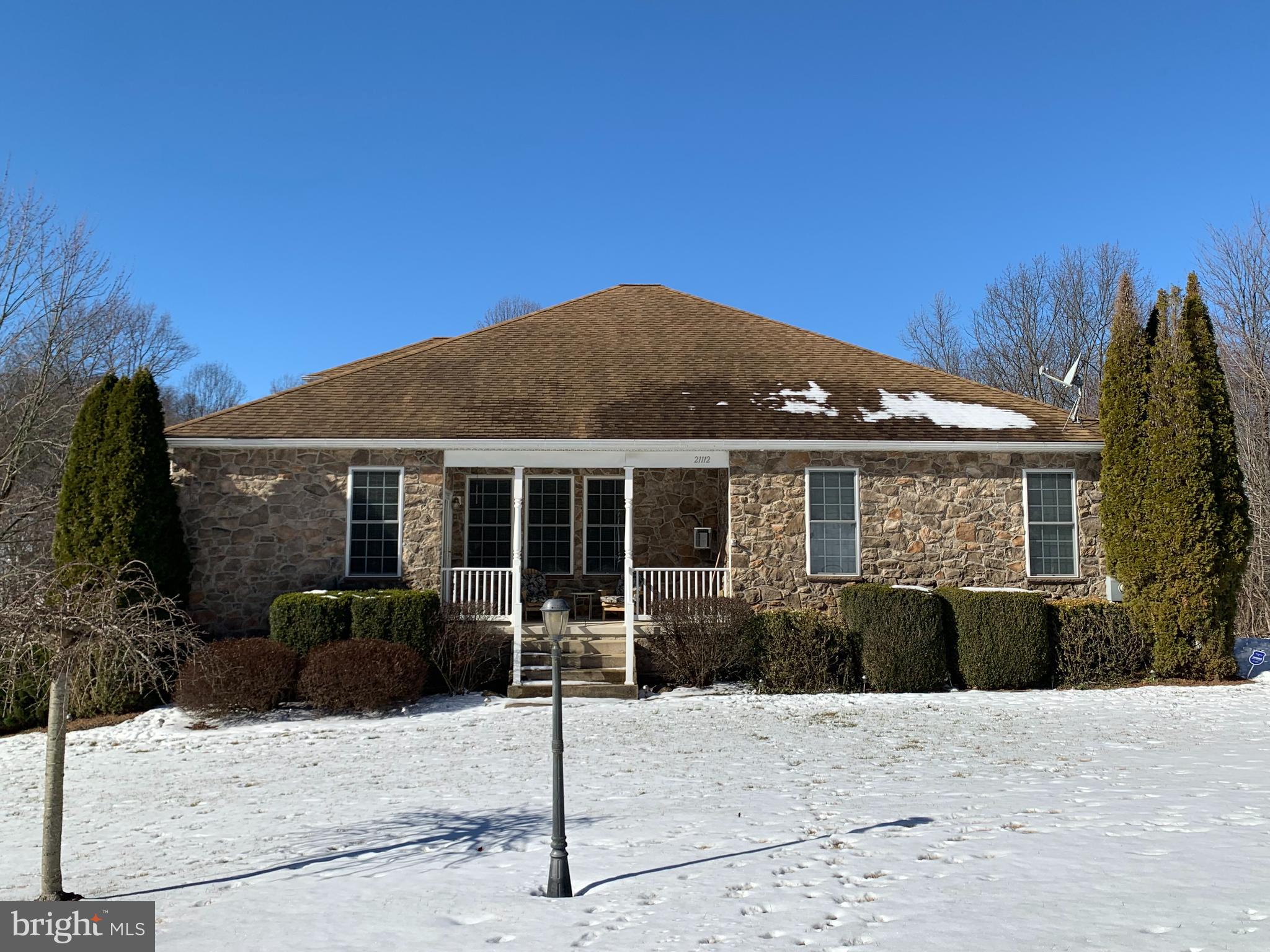 21112 Park Hall Road Boonsboro, MD 21713 - Photo 2 of 39 a front view of a house with a garden