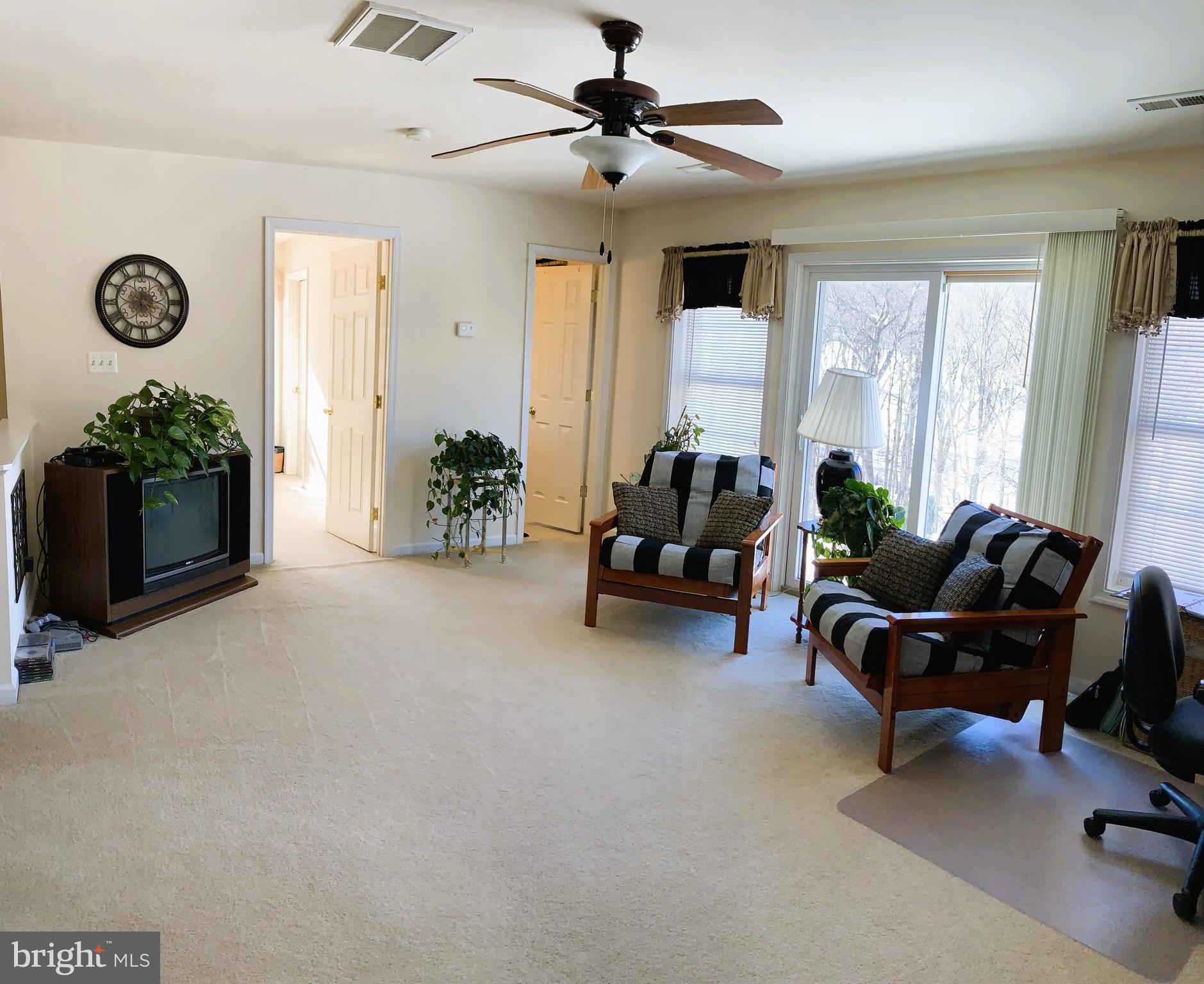 21112 Park Hall Road Boonsboro, MD 21713 - Photo 28 of 39 a living room with furniture plant and a window