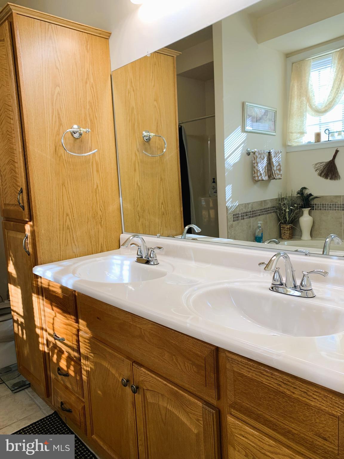 21112 Park Hall Road Boonsboro, MD 21713 - Photo 32 of 39 a bathroom with a granite countertop sink and a mirror