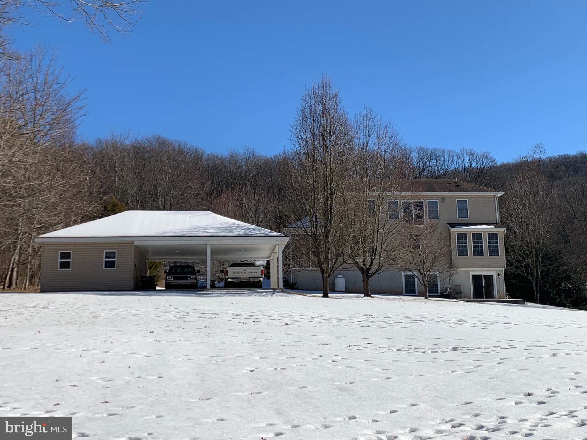 21112 Park Hall Road Boonsboro, MD 21713 - Photo 6 of 39 a view of a house with a yard covered in snow