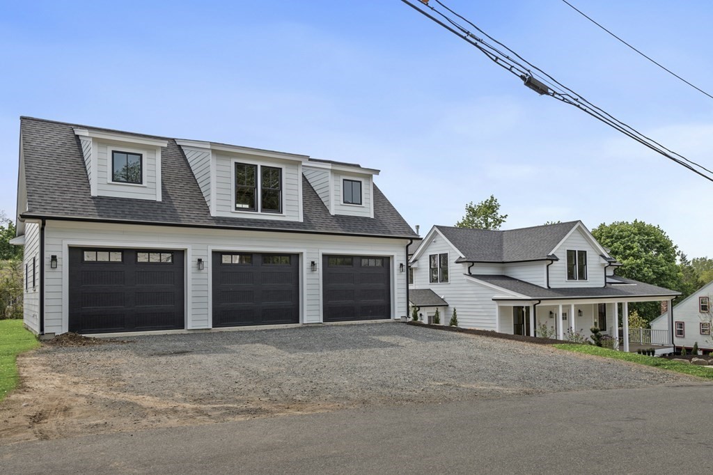 2 Whittier Road Marblehead, MA 01945 - Photo 7 of 41 a front view of a house with a yard and garage