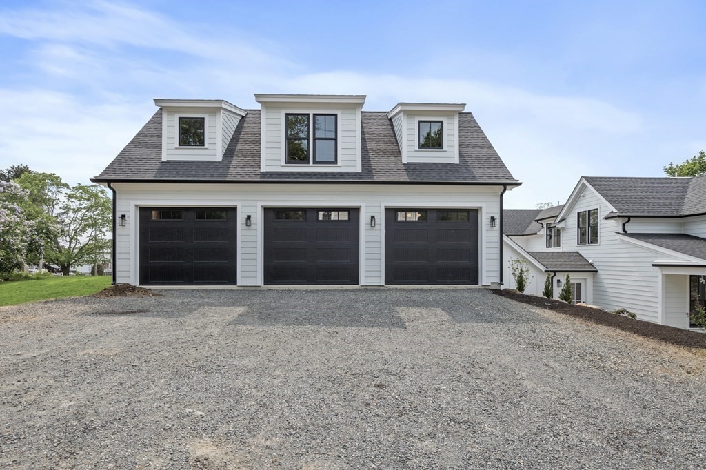 2 Whittier Road Marblehead, MA 01945 - Photo 8 of 41 a front view of a house with a yard and garage