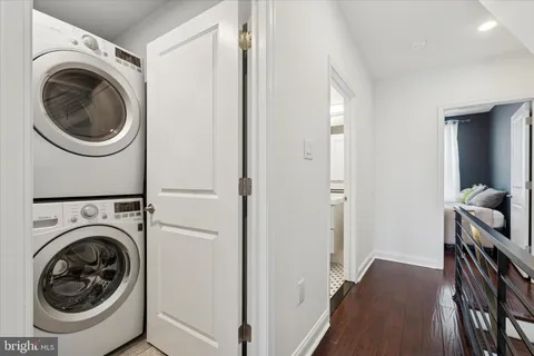 a view of a hallway with washer and dryer