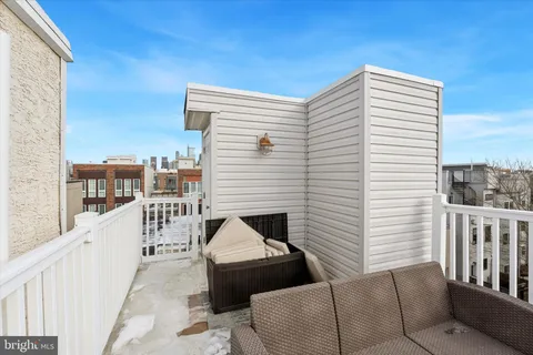 a view of balcony with furniture