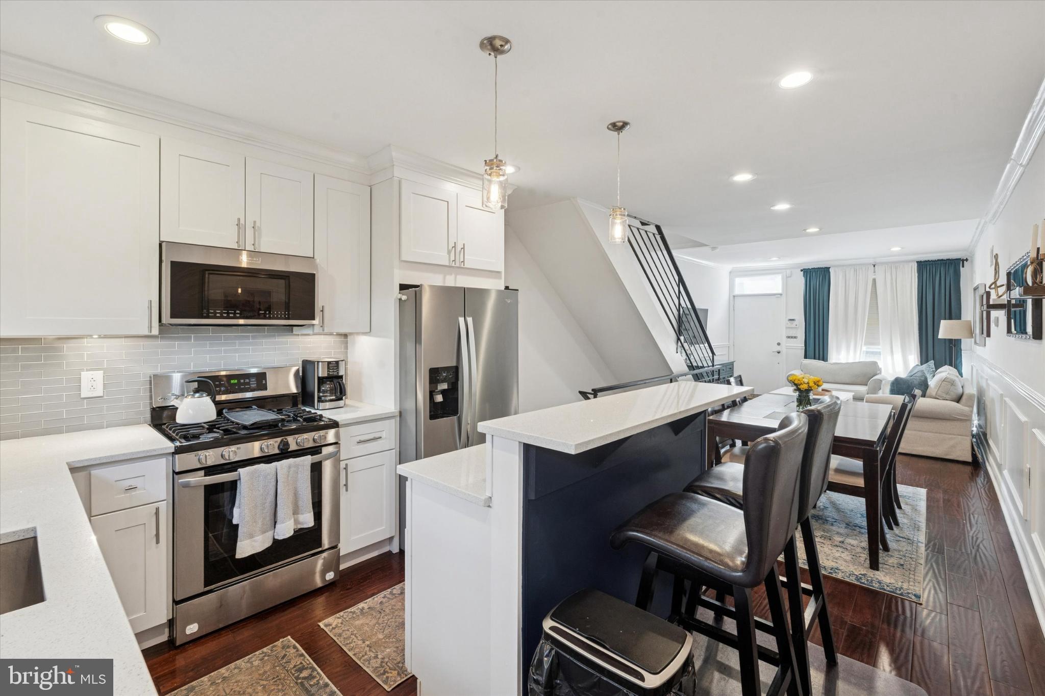 1933 Wilder Street Philadelphia, PA 19146 - Photo 7 of 24 Modern kitchen flows into inviting living space.