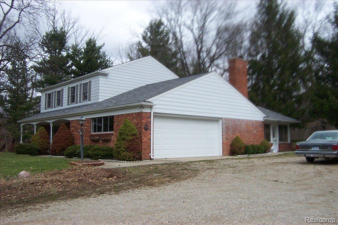 1732 North Hughes Road Howell, MI 48843 - Photo 8 of 25 garage & florida room