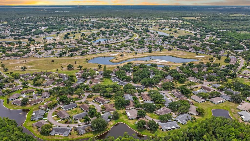 2034 Hawkhurst Circle, Unit 178 Sun City Center, FL 33573 - Photo 12 of 46 an aerial view of residential houses with outdoor space