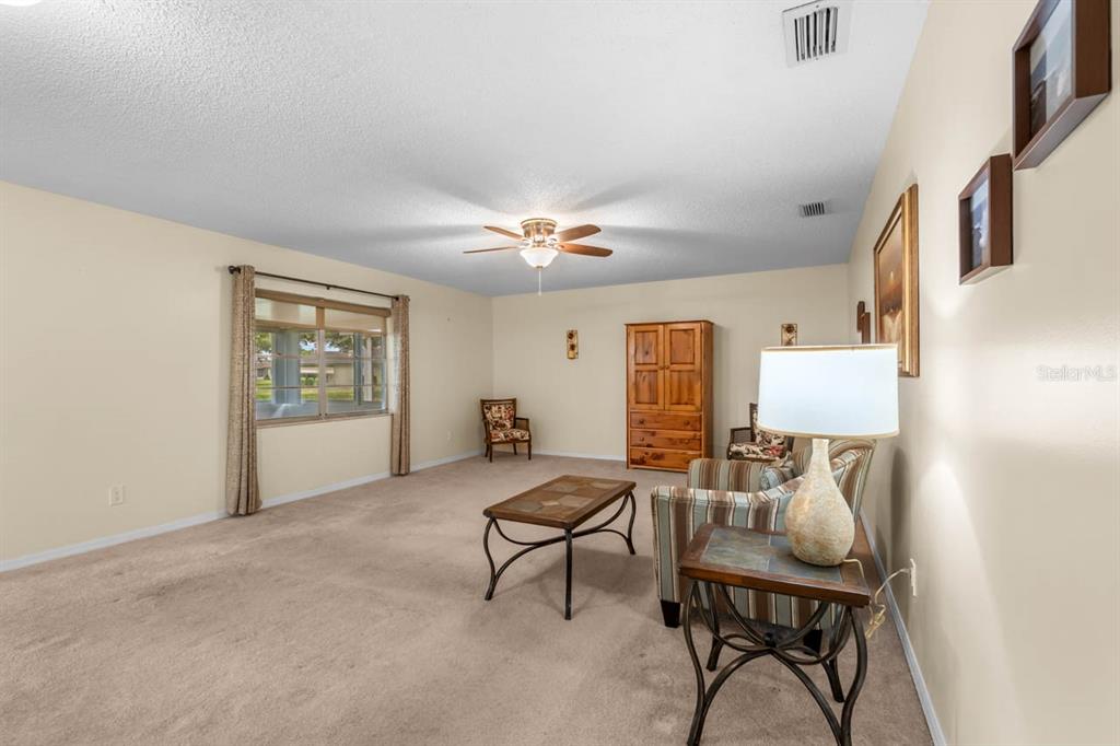 2034 Hawkhurst Circle, Unit 178 Sun City Center, FL 33573 - Photo 13 of 46 a living room with furniture and a window