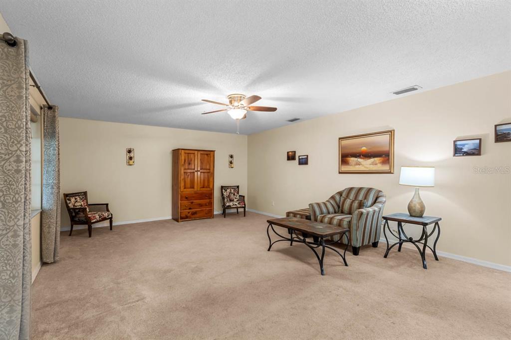 2034 Hawkhurst Circle, Unit 178 Sun City Center, FL 33573 - Photo 14 of 46 a living room with furniture and a air conditioner vent