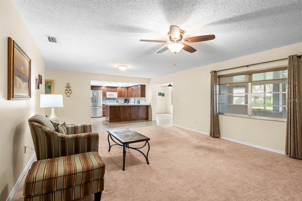 2034 Hawkhurst Circle, Unit 178 Sun City Center, FL 33573 - Photo 16 of 46 a living room with furniture and a window