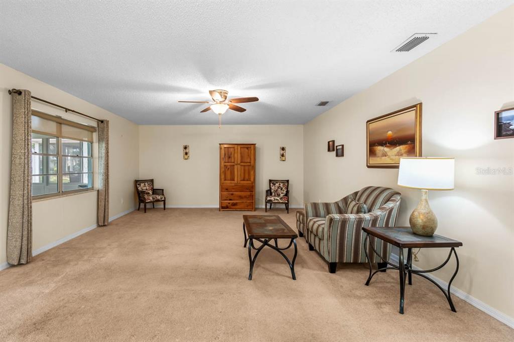2034 Hawkhurst Circle, Unit 178 Sun City Center, FL 33573 - Photo 22 of 46 a view of a livingroom with furniture and a window