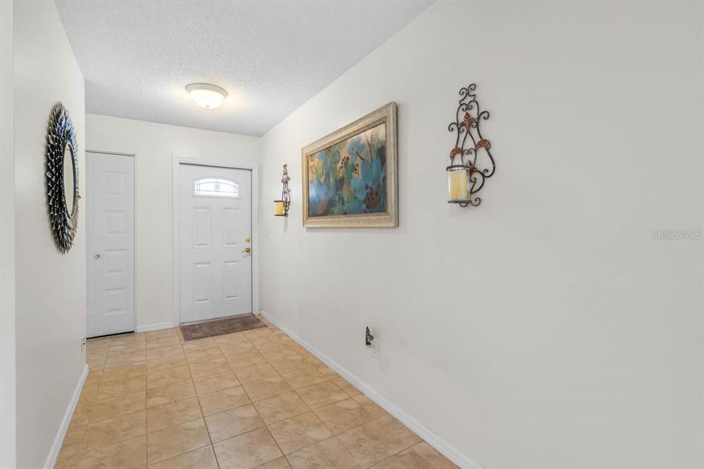 2034 Hawkhurst Circle, Unit 178 Sun City Center, FL 33573 - Photo 23 of 46 a view of a room with a painting on the wall