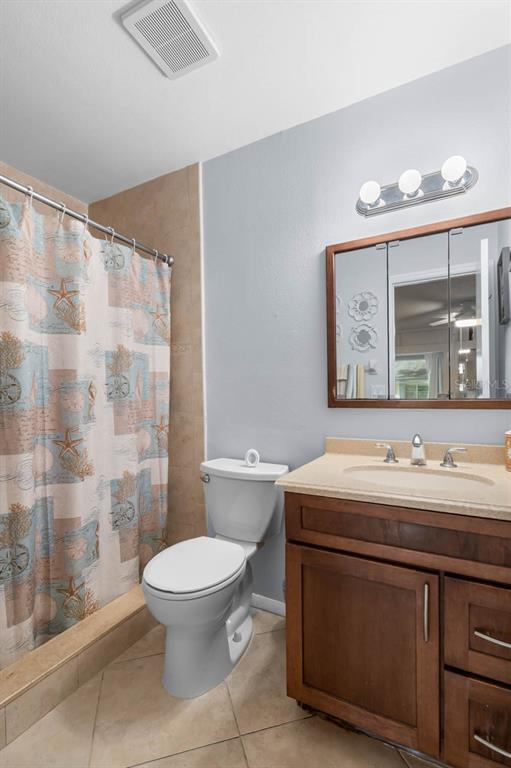2034 Hawkhurst Circle, Unit 178 Sun City Center, FL 33573 - Photo 27 of 46 a bathroom with a sink a toilet and a mirror