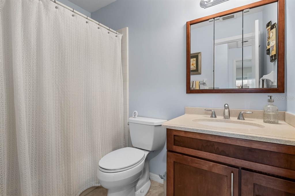 2034 Hawkhurst Circle, Unit 178 Sun City Center, FL 33573 - Photo 29 of 46 a bathroom with a sink a toilet and a mirror