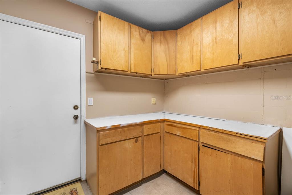 2034 Hawkhurst Circle, Unit 178 Sun City Center, FL 33573 - Photo 30 of 46 a utility room with dryer and washer