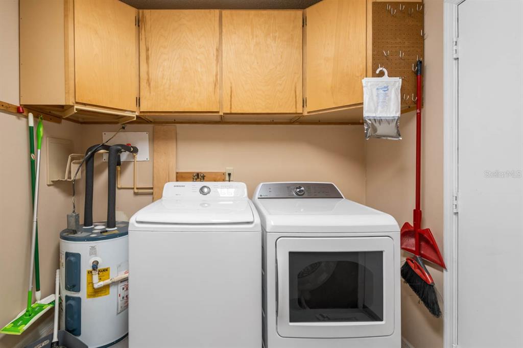2034 Hawkhurst Circle, Unit 178 Sun City Center, FL 33573 - Photo 31 of 46 a utility room with dryer and washer