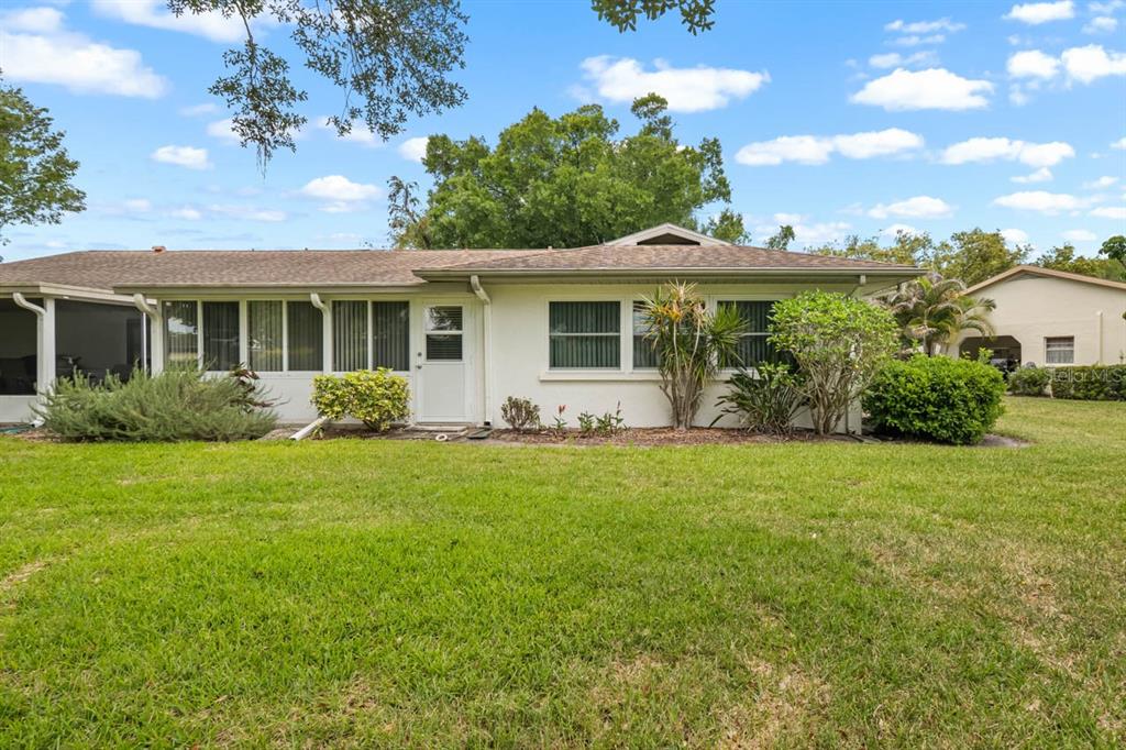 2034 Hawkhurst Circle, Unit 178 Sun City Center, FL 33573 - Photo 43 of 46 a view of a house with backyard and garden