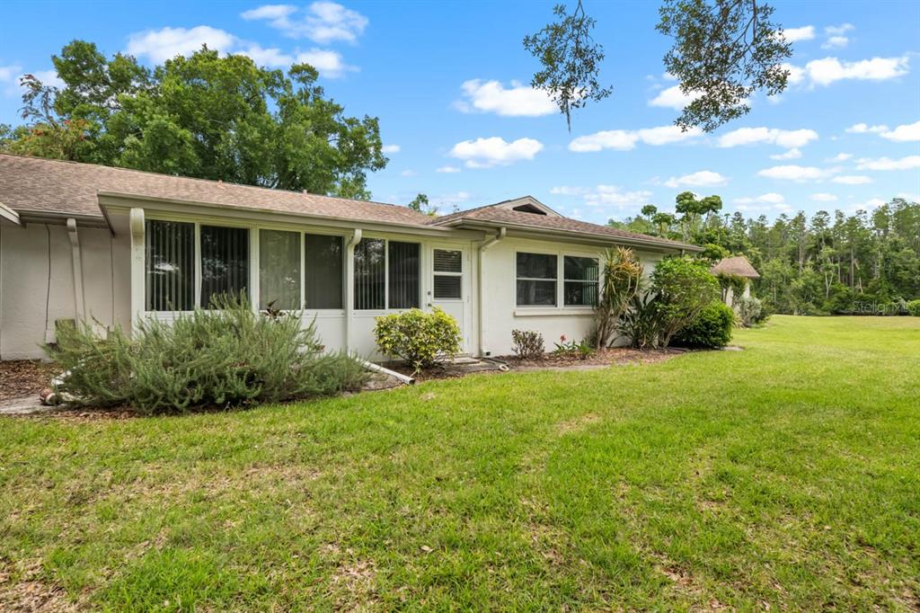 2034 Hawkhurst Circle, Unit 178 Sun City Center, FL 33573 - Photo 45 of 46 a view of a house with backyard and garden