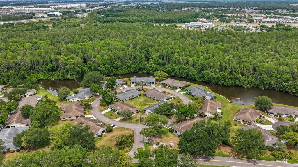 2034 Hawkhurst Circle, Unit 178 Sun City Center, FL 33573 - Photo 6 of 46 an aerial view of a house with a yard