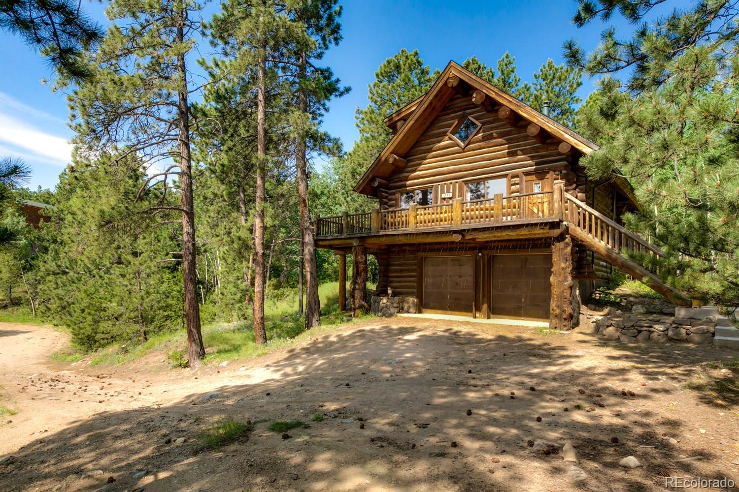 195 Pine Road Golden, CO 80403 - Photo 2 of 31 a front view of a house with a yard