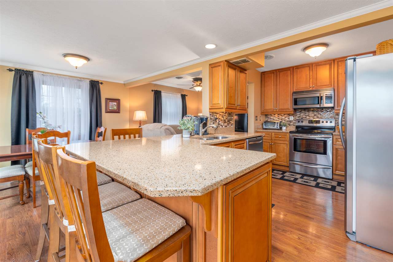 950 Cattle Scales Road Waynesboro, VA 22980 - Photo 14 of 50 a kitchen with stainless steel appliances granite countertop a sink a stove and a refrigerator