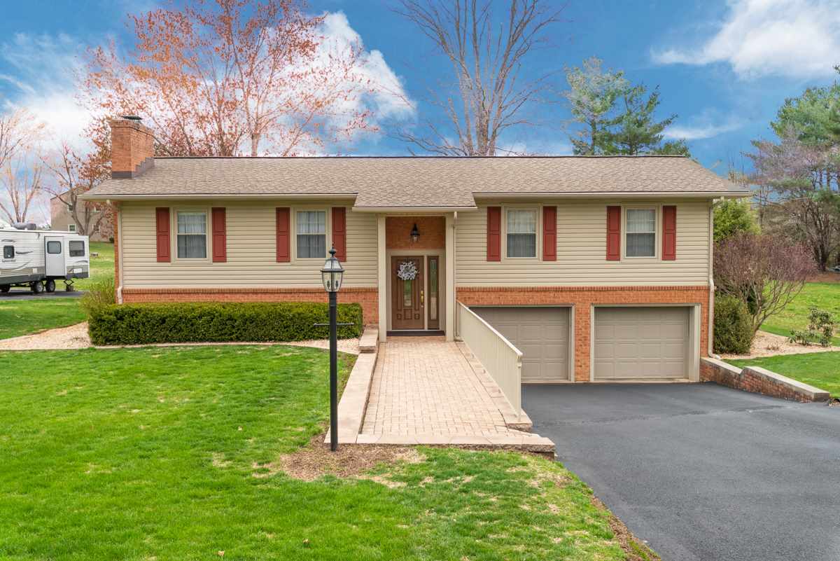 950 Cattle Scales Road Waynesboro, VA 22980 - Photo 2 of 50 a front view of a house with a yard and garage